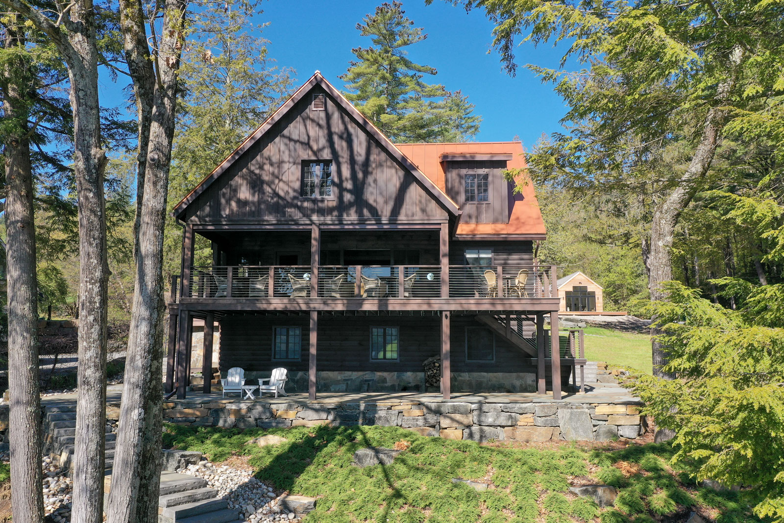 AJA crafted an expansive covered deck area capable of hosting the entire family. Included in the renovations was new landscaping with beautiful locally sourced stone.