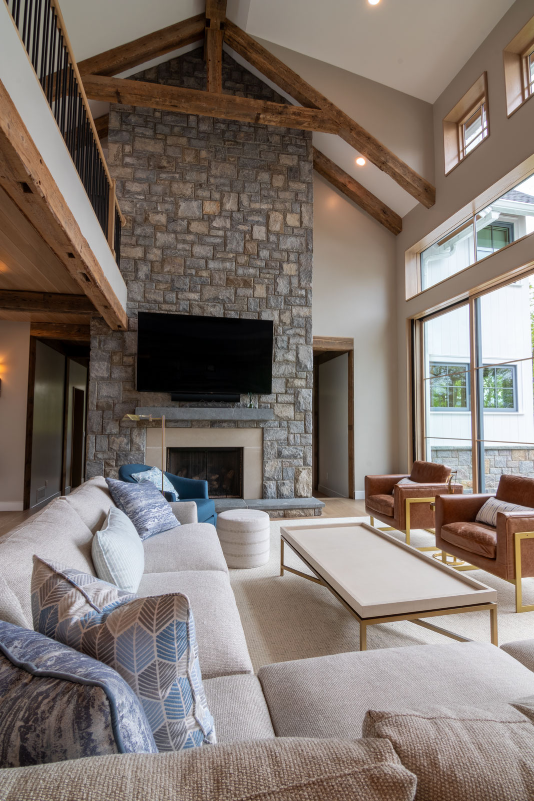 Gather's at Harper's Fin Residence are enhanced by the natural stone fireplace that center pieces the open floor plan. 