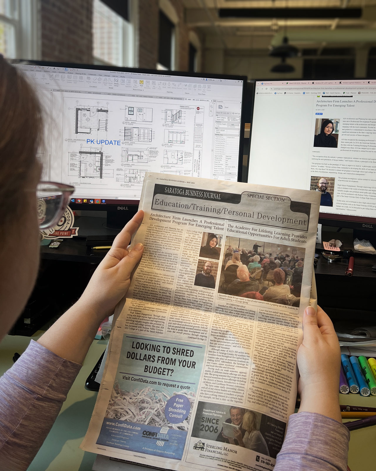 A member of the team at AJA Architecture and Planning Reading the featured article in the Saratoga Business Journal about our firms Professional Development Program