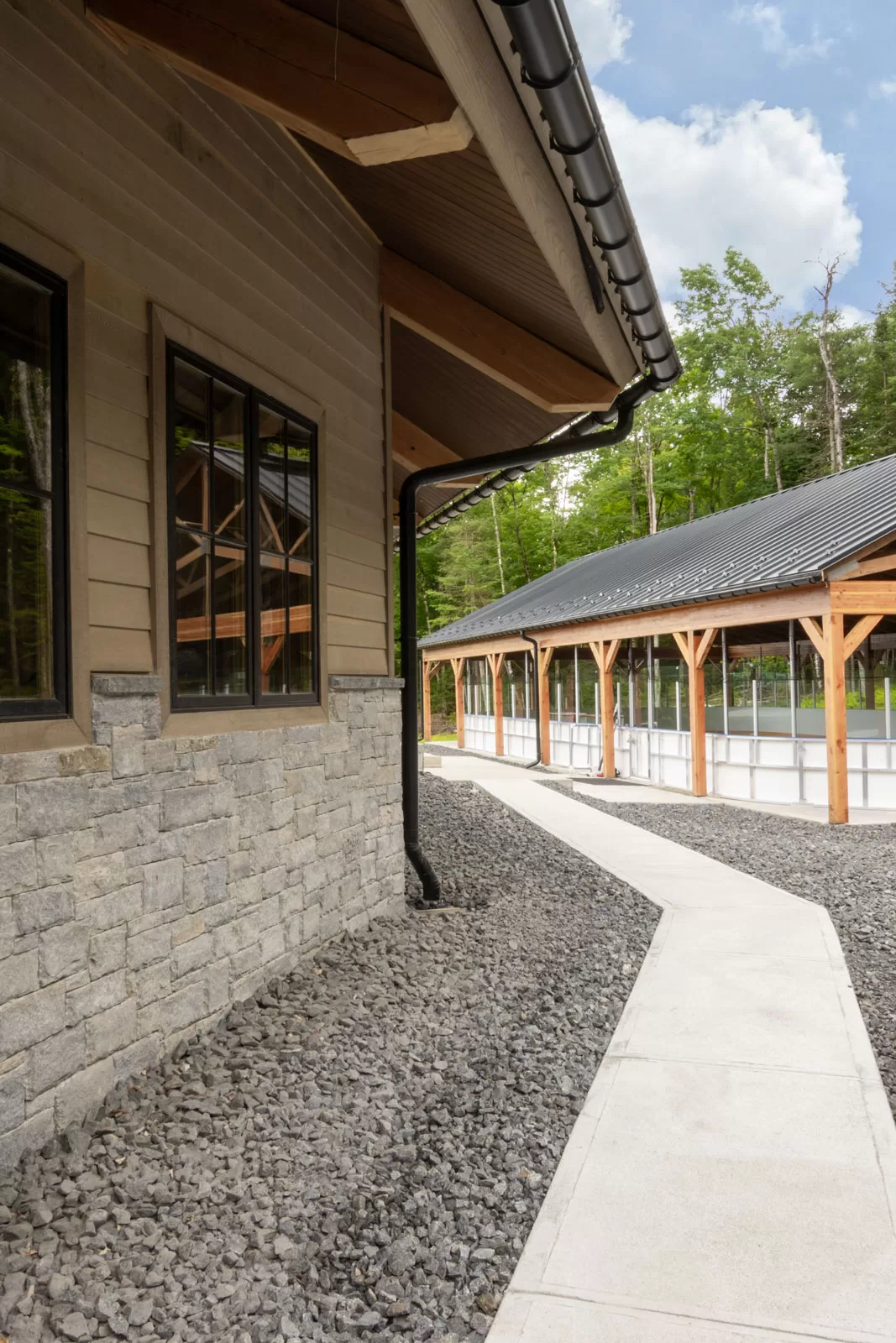 A pathway from the porte-cochere entrance to the custom competition size hockey rink.