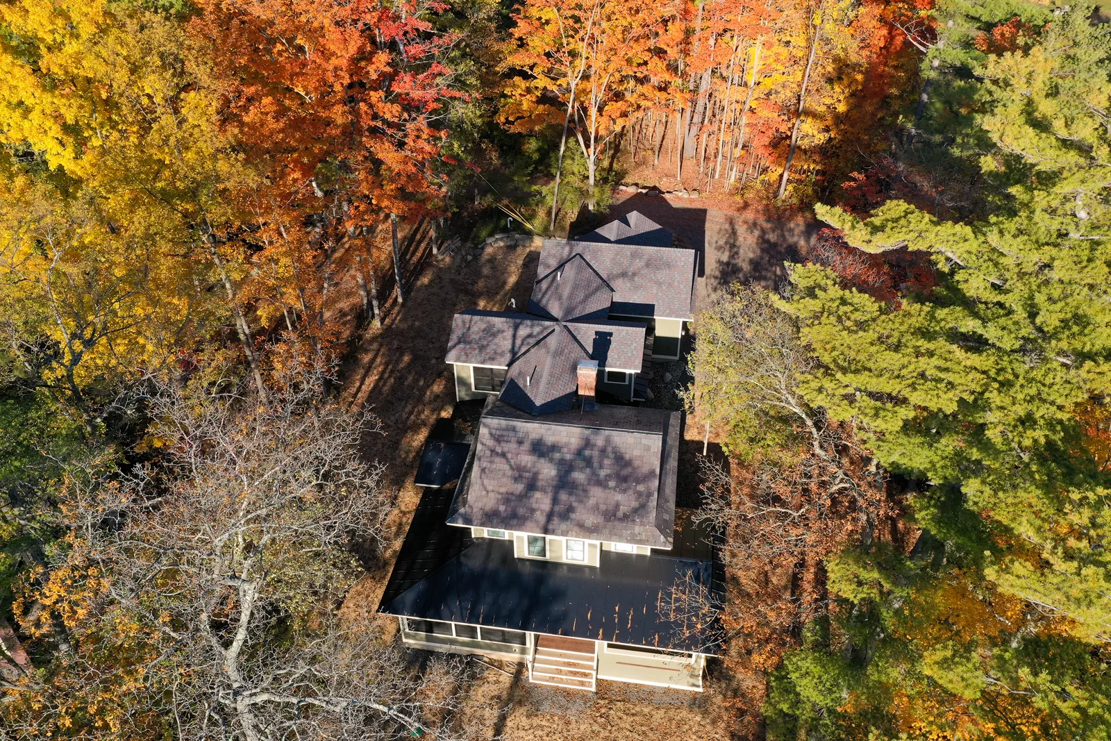 Bayview Bliss Residence on Lake George from an aerial view with fall leaves.